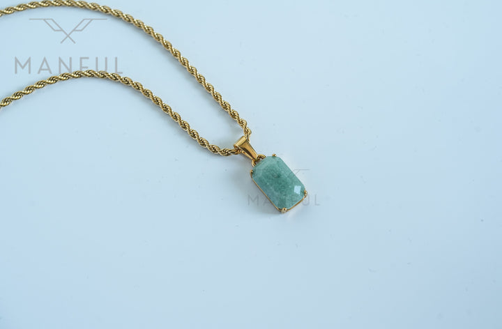 Jade Stone Pendant Gold, close-up on a white background with the chain draped diagonally