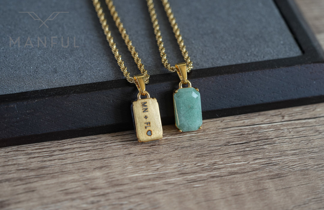 Jade Stone Pendant Gold, paired beside a matching engraved wood tag necklace on a dark tray