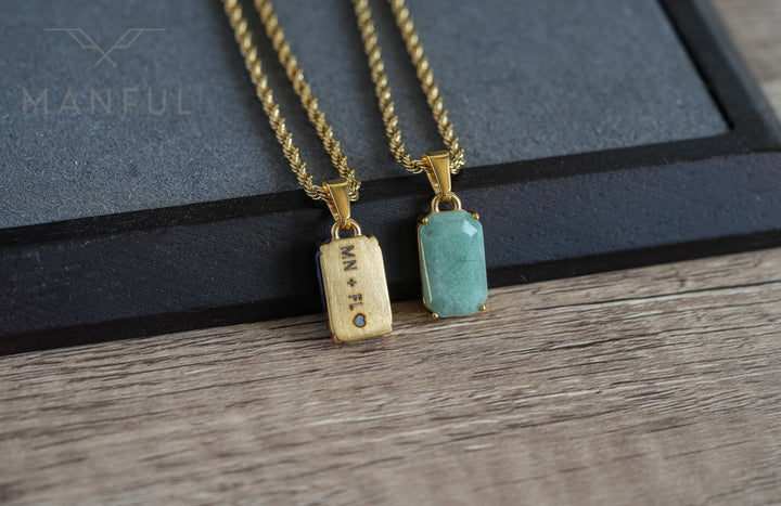 Jade Stone Pendant Gold, paired beside a matching engraved wood tag necklace on a dark tray