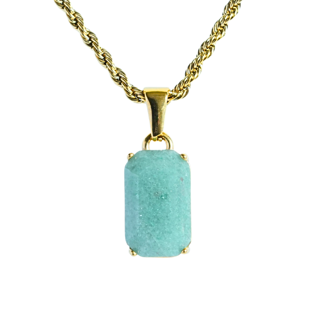 Jade Stone Pendant Gold, isolated on a white background hanging straight down on a rope chain