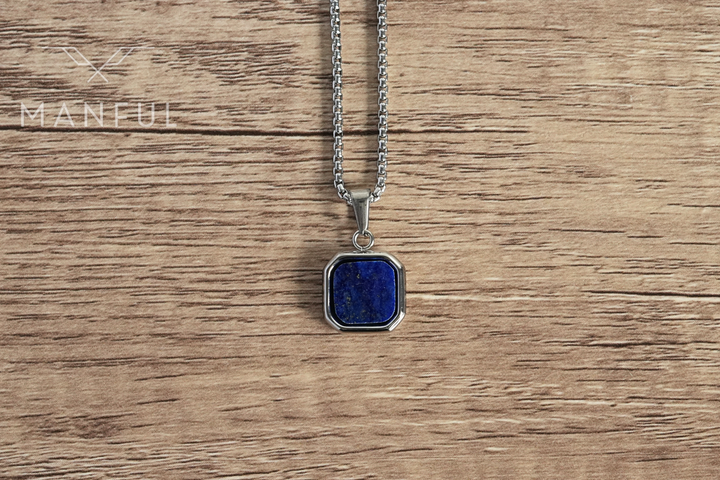 Lapis Square Necklace Silver, lying flat on a wood surface with the blue lapis stone in focus