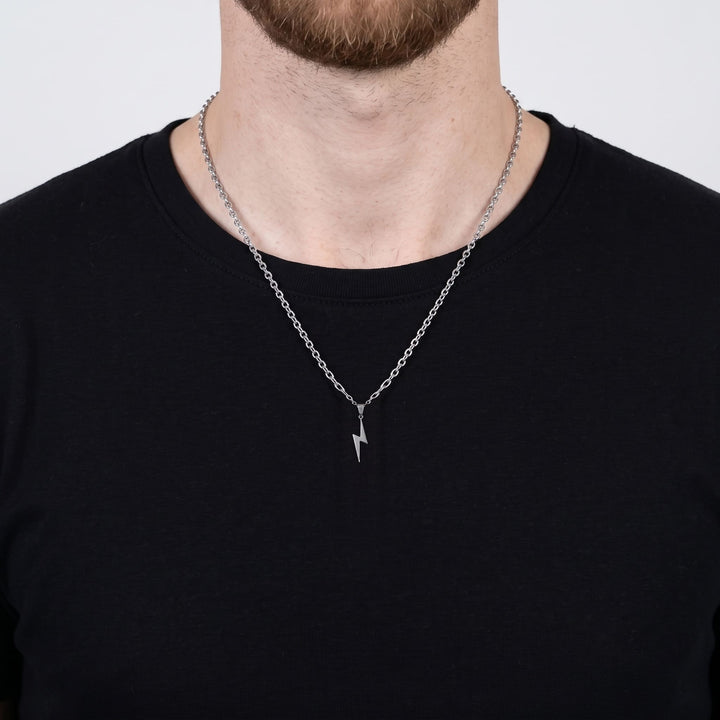 Lightning Pendant Necklace (Silver) on a man's chest over a black t-shirt