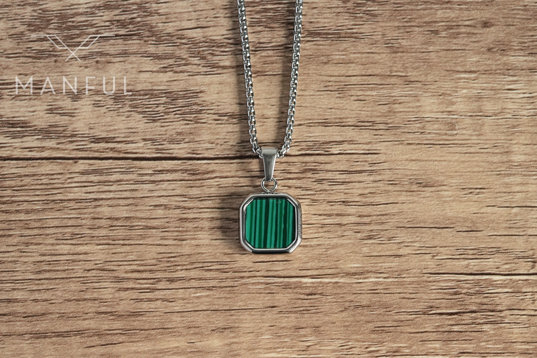 Malachite Square Necklace Silver, flat lay on a wood surface showing the front face