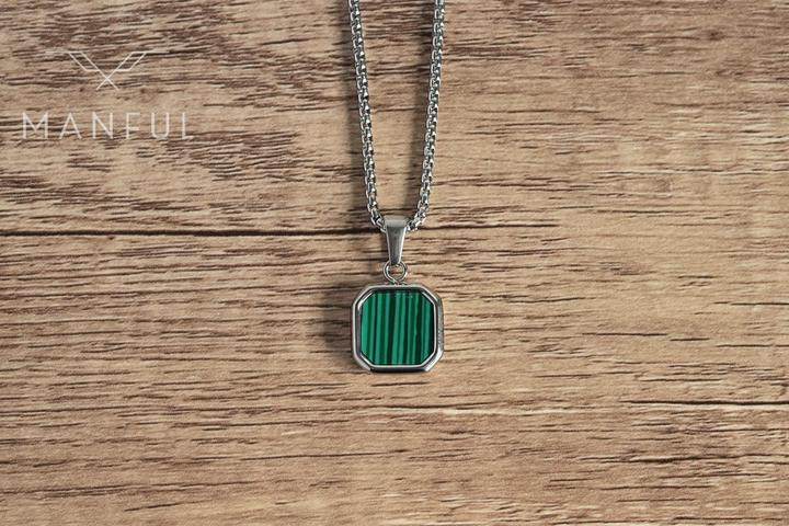 Malachite Square Necklace Silver, flat lay on a wood surface showing the front face