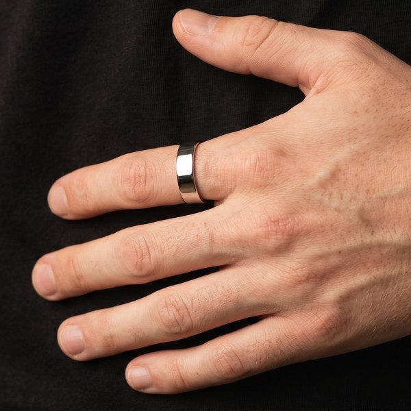 Mens Minimalist Rings Collection, a plain polished silver 6mm ring on a man's index finger