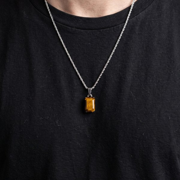 Mens Pendants Collection, a tigers eye stone pendant on a silver rope chain worn over a black tee