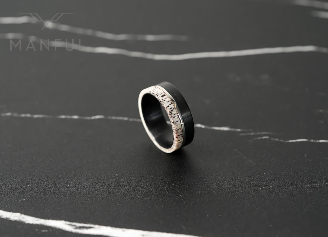 Midnight Antler Band, standing on a dark marble surface at an angle