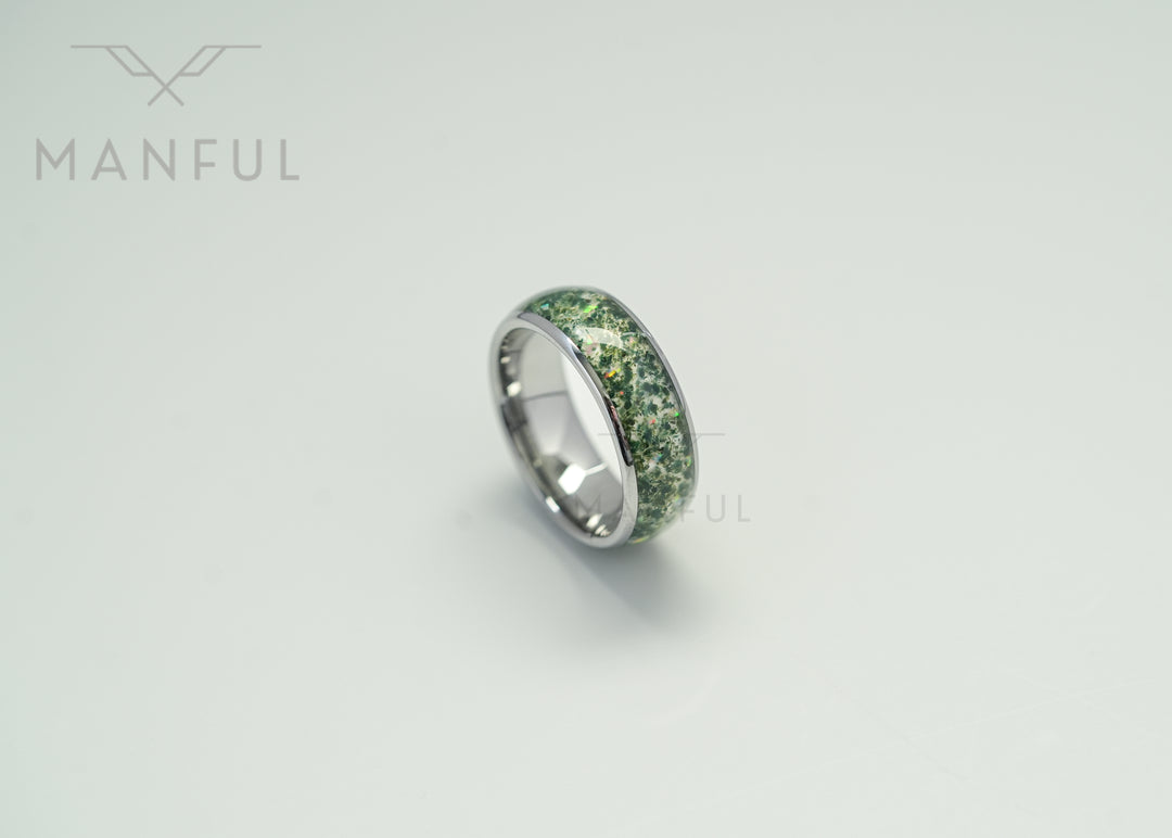 Moss Agate & Crushed Opal Ring, isolated on a white background in a close-up angled view
