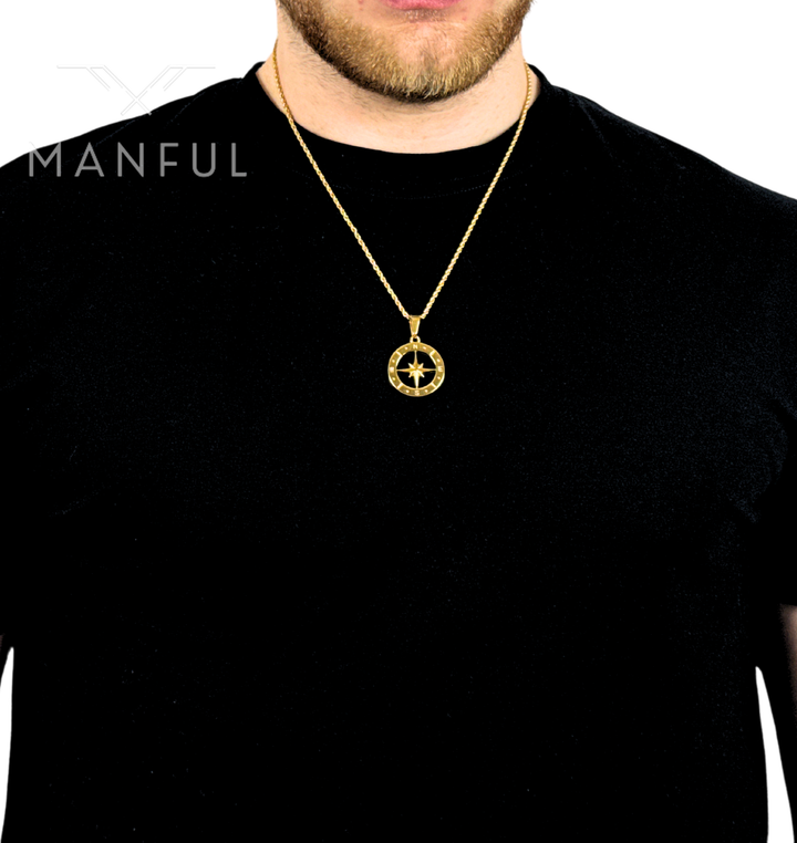 North Star Compass Pendant Necklace Gold, worn against a black t-shirt