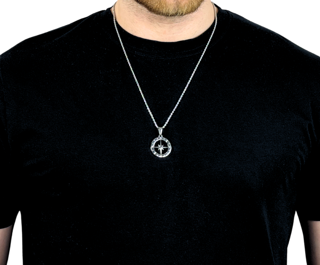 North Star Compass Pendant Necklace Silver, worn around a man's neck over a black t-shirt