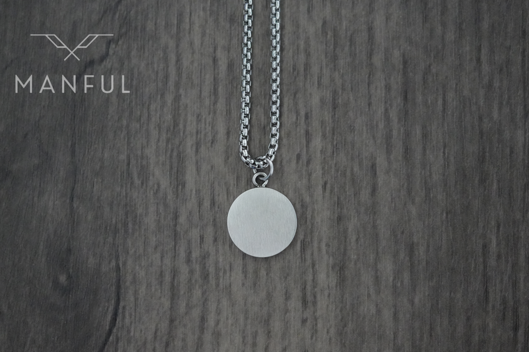 Onyx Circle Necklace, flipped to show the plain brushed silver reverse side