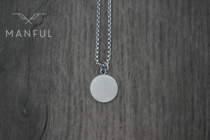 Onyx Circle Necklace, flipped to show the plain brushed silver reverse side