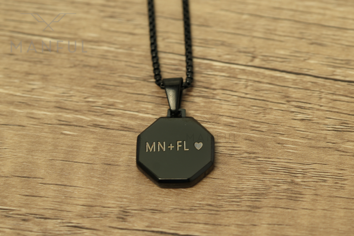 Onyx Octagon Necklace Black, close-up of the pendant engraved with initials and a heart