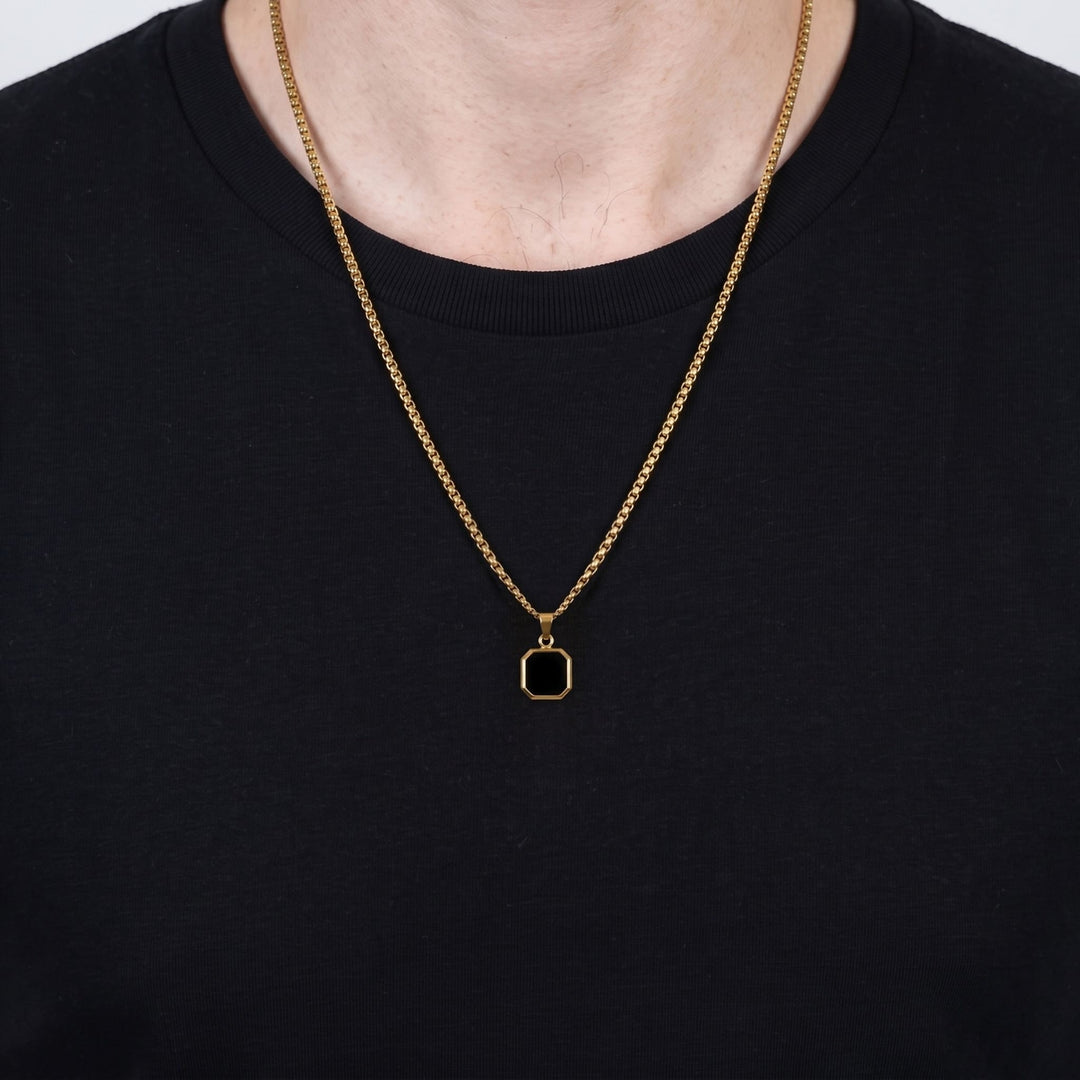 Onyx Square Necklace (Gold) on a man's chest over a black t-shirt