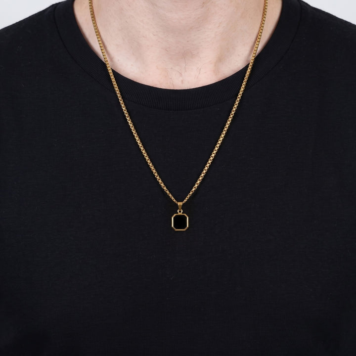 Onyx Square Necklace (Gold) on a man's chest over a black t-shirt