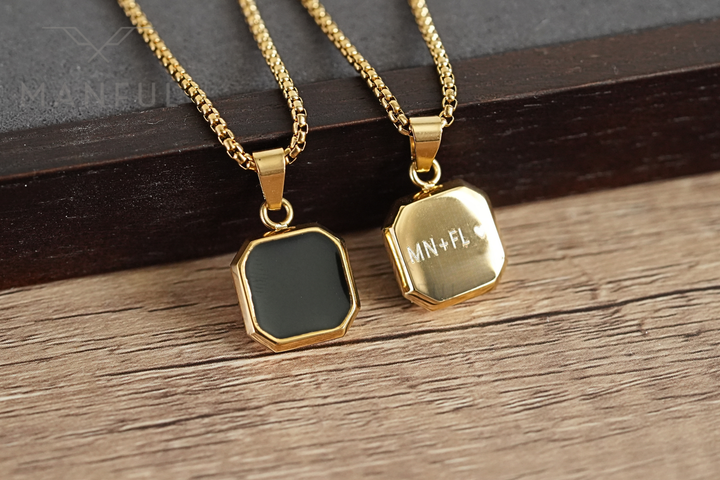 Onyx Square Necklace Gold, shown beside a second pendant engraved on the back