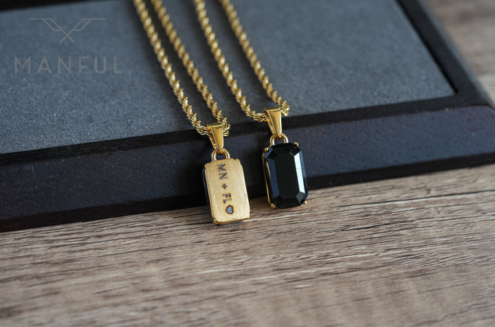 Onyx Stone Pendant Gold, paired on wood with a matching engraved gold pendant