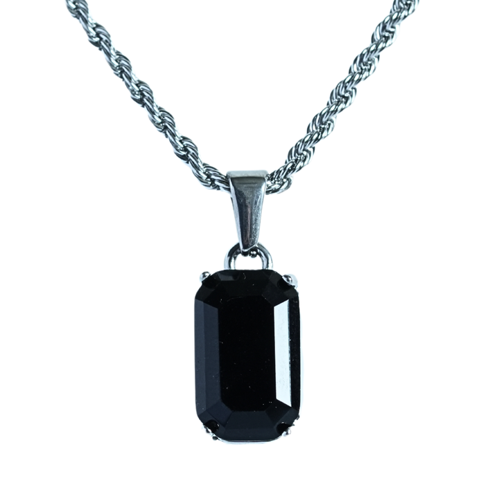 Onyx Stone Pendant Silver, isolated on white background hanging straight on its chain
