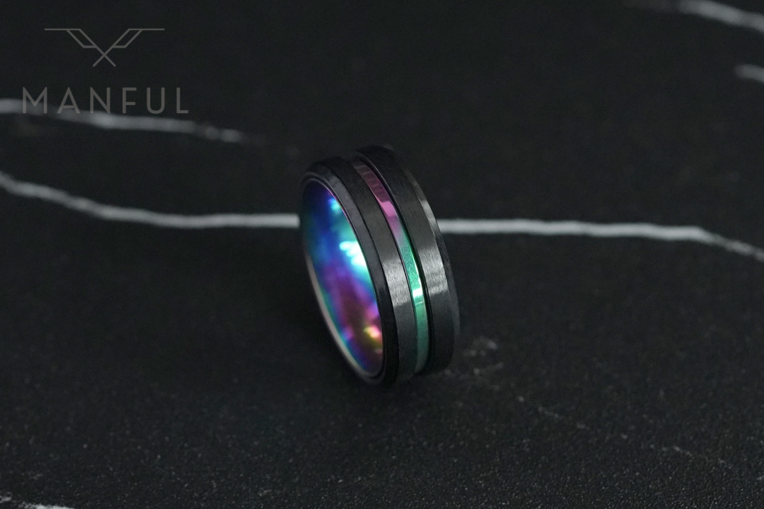 Rainbow Band, angled close up on dark marble with a pale vein streak above