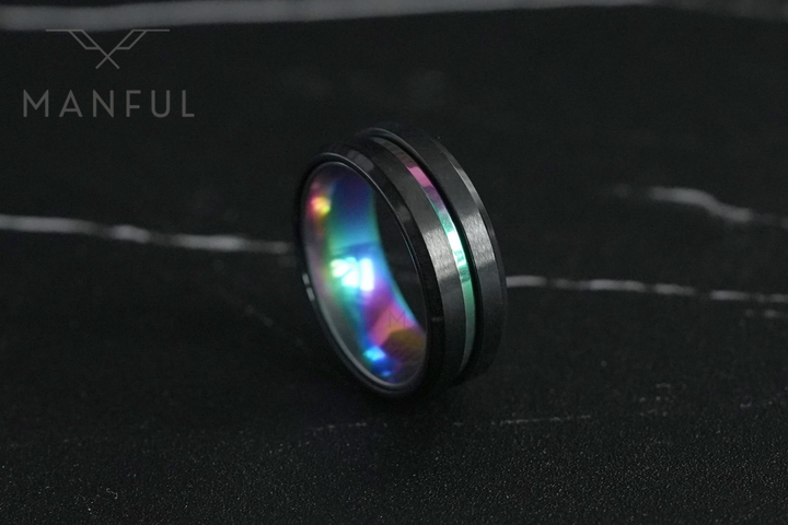 Rainbow Band, pulled back on dark marble with veining arching across the top