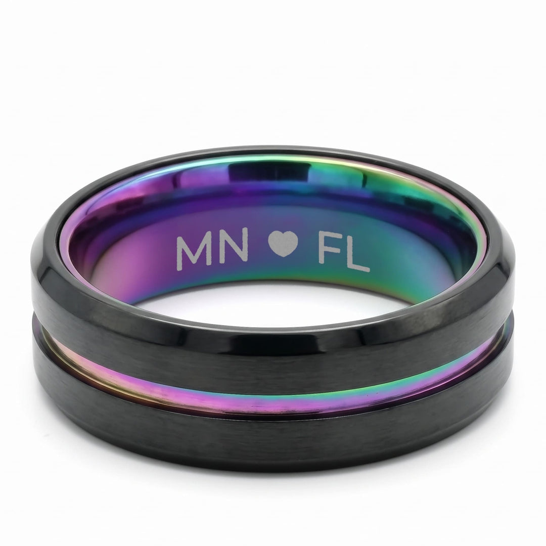 Rainbow Band engraving example: MN, a heart and FL engraved inside the rainbow band