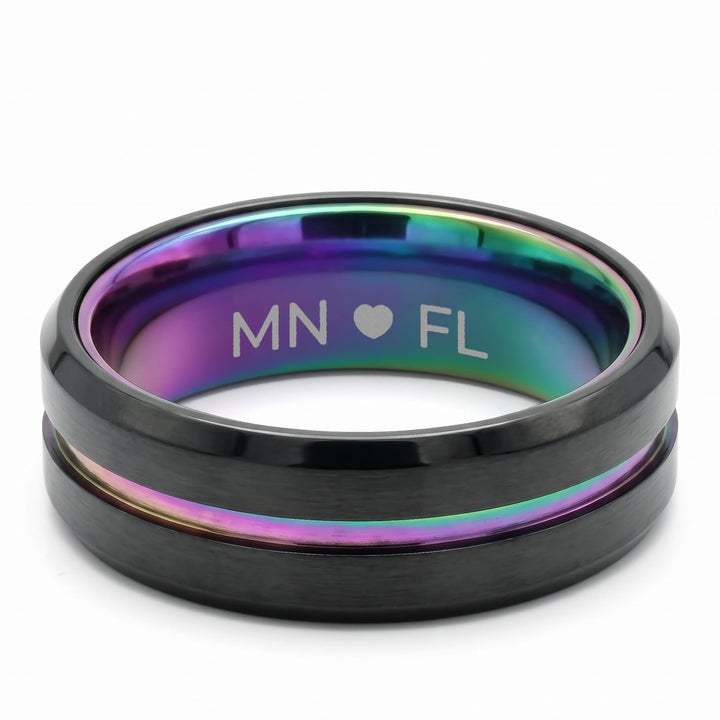 Rainbow Band engraving example: MN, a heart and FL engraved inside the rainbow band