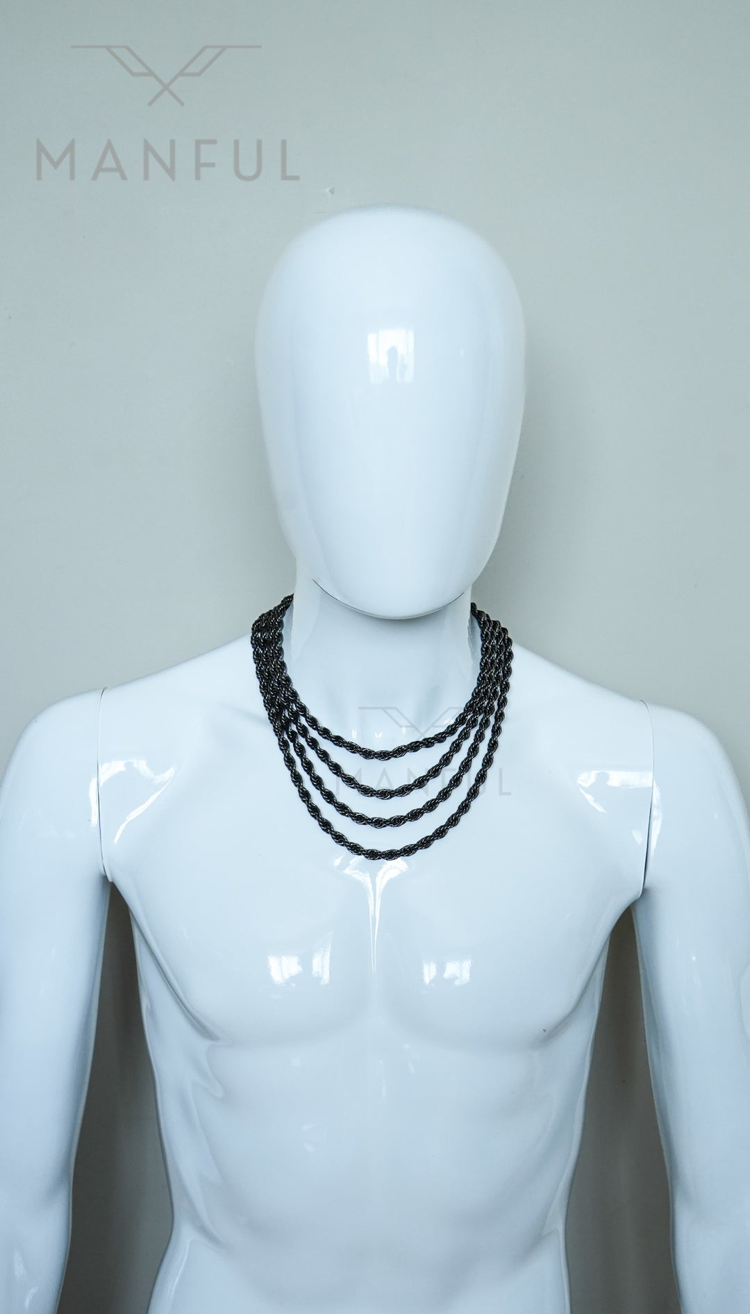Rope Chain 7mm Black, worn layered with three other rope chains on a mannequin torso