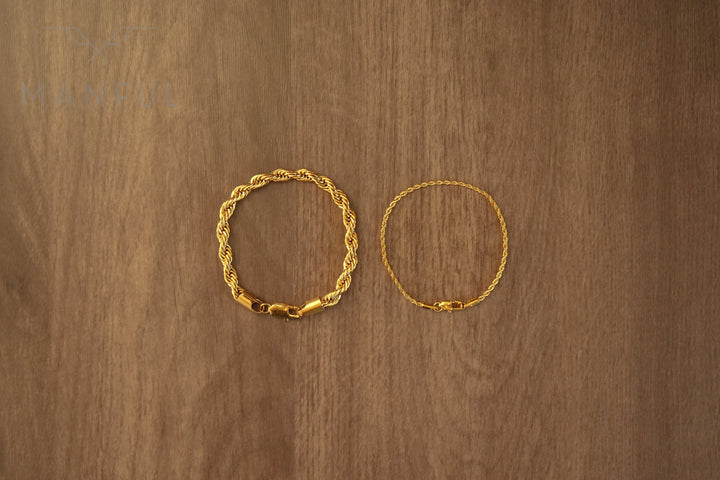 Rope Chain Bracelet Gold, laid in a circle on a wood surface beside a thinner rope bracelet