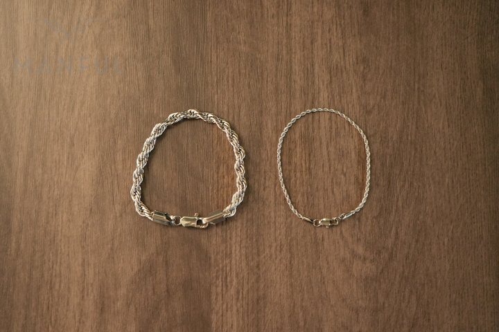 Rope Chain Bracelet Silver, laid flat on wood next to a thinner rope chain bracelet