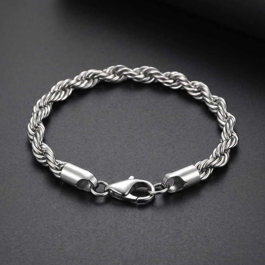 Rope Chain Bracelet (Silver) lying on matte charcoal