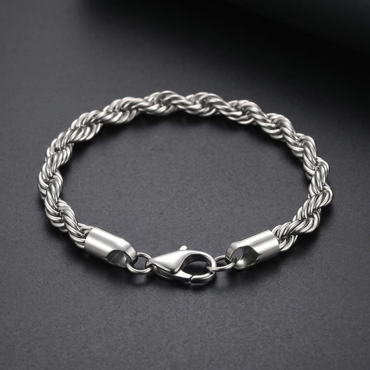 Rope Chain Bracelet (Silver) lying on matte charcoal