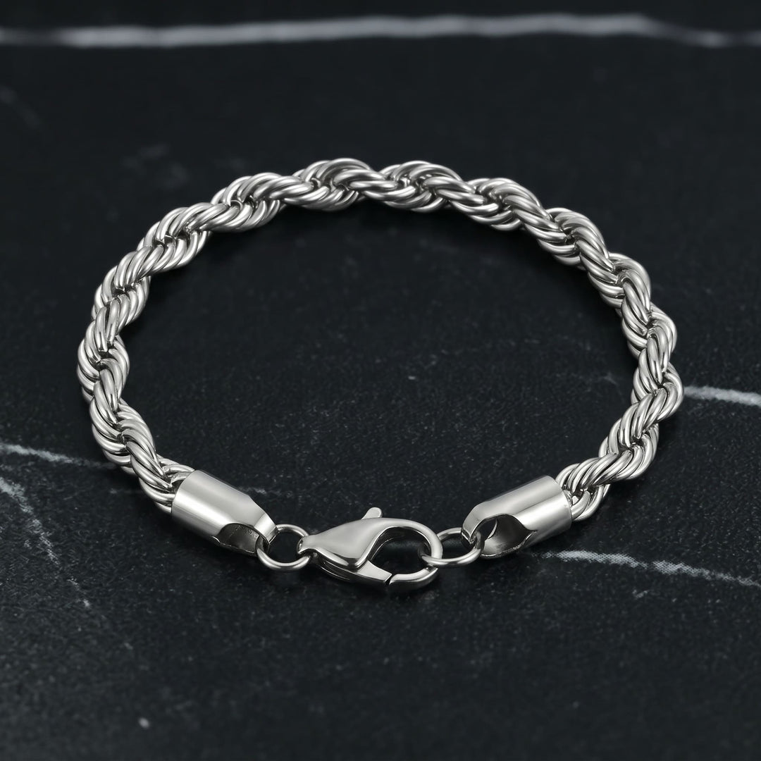 Rope Chain Bracelet (Silver) lying on black marble with thin white veins