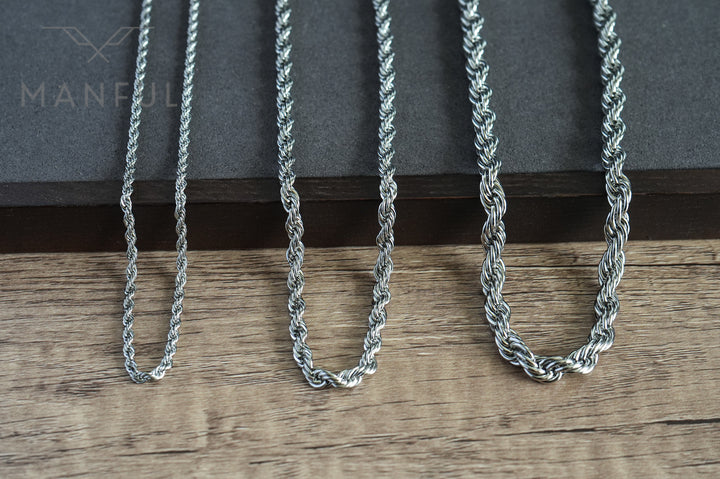 Rope Chain 7mm Silver, laid on wood beside two thinner rope chains showing the thickness options