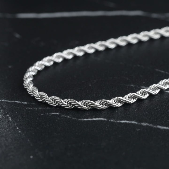 Rope Chain 7mm Silver on black marble with thin white veins