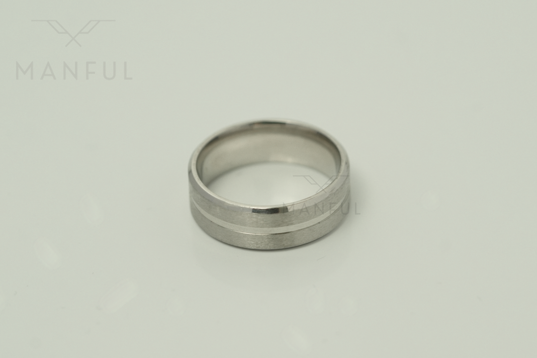 Silver Band, lying flat viewed from above on a pale grey background