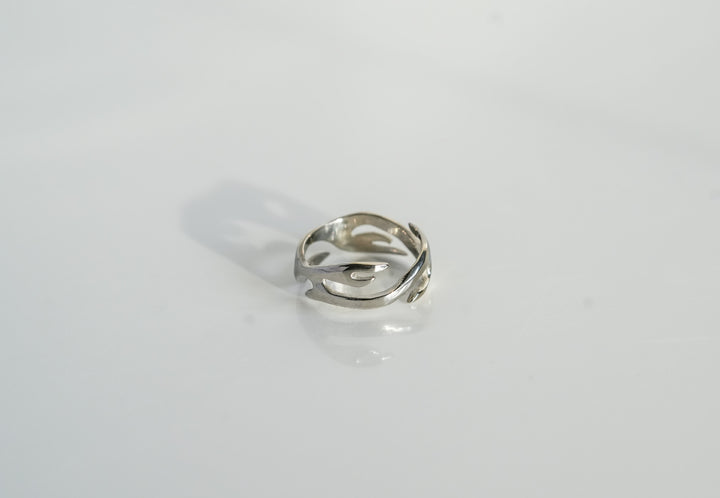 Silver Flame Ring, isolated on white, top-down view of the flame swirl