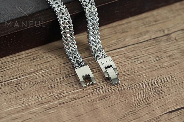 Foxtail Bracelet Silver, unfastened ends resting on wood with N+N engraving