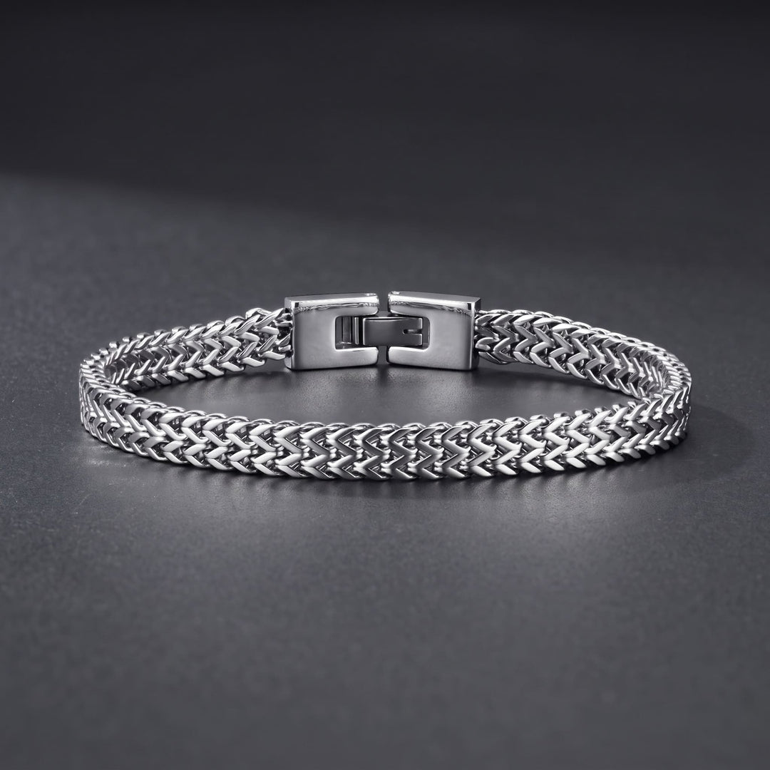 Foxtail Bracelet (Silver) lying on a dark charcoal surface