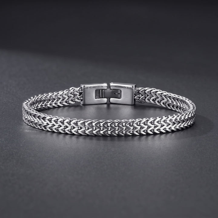 Foxtail Bracelet (Silver) lying on a dark charcoal surface