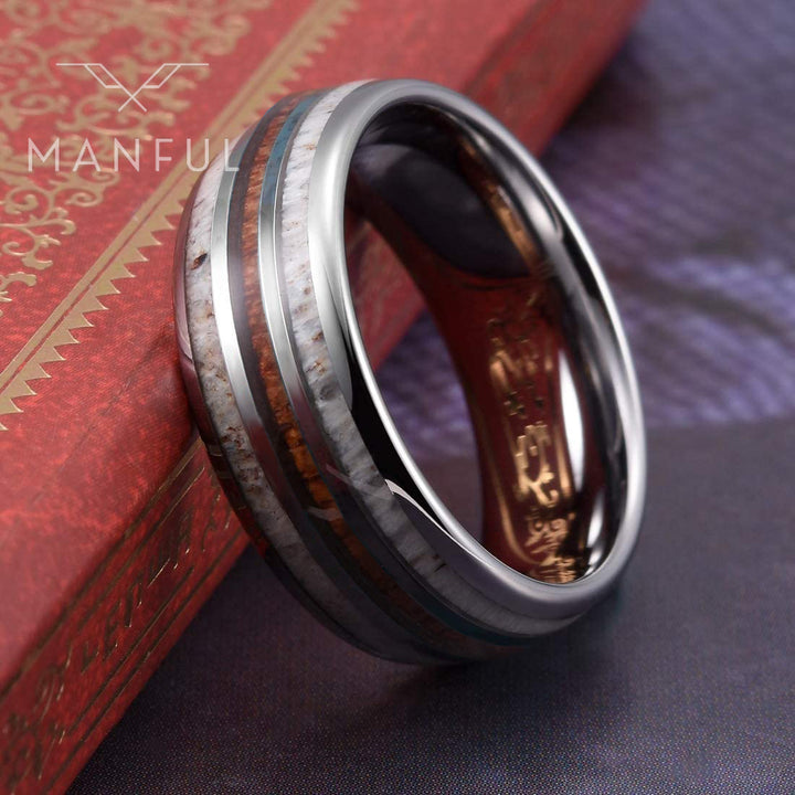 Silver Woodland Band, propped against a red book, angled to show the profile