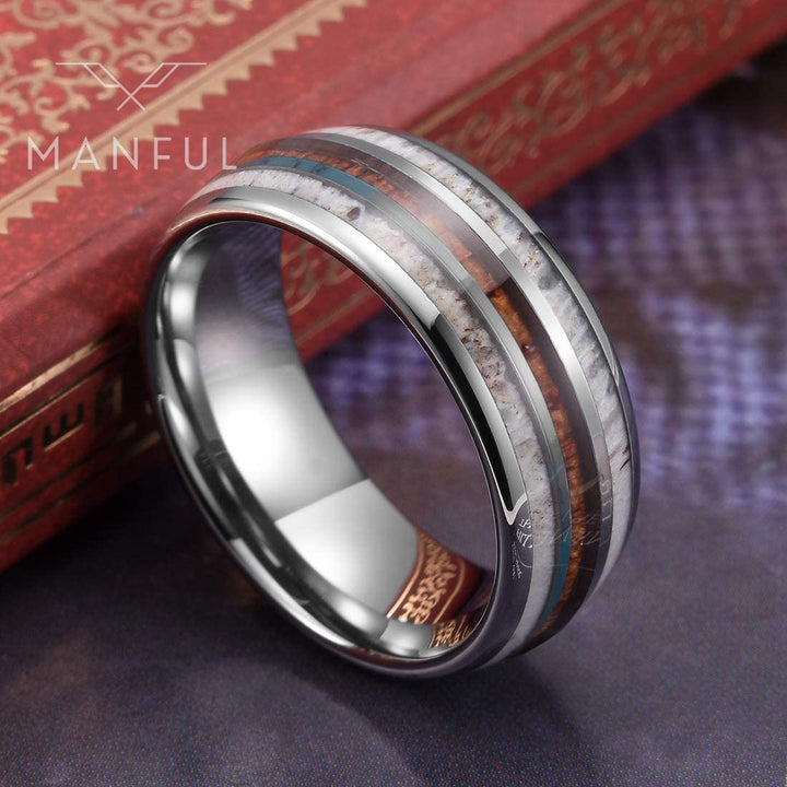 Silver Woodland Band, propped against a red book, rotated to show the face