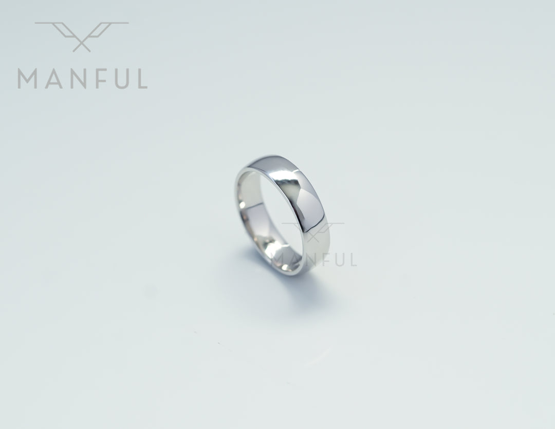 Simple 6mm 925 Silver Ring, standing upright on a pale grey background