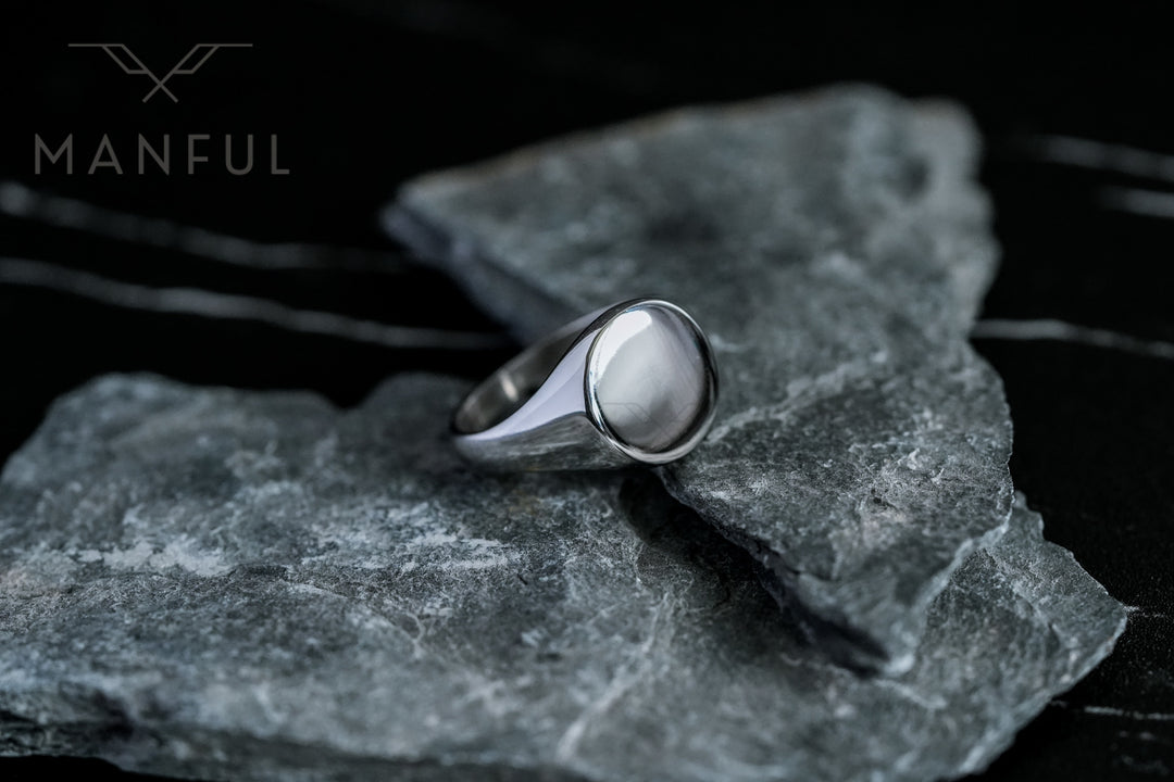 Classic Silver Signet Ring, resting on a slab of grey slate