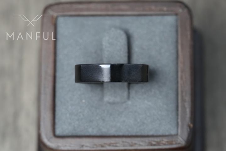 Simple 6mm Ring Black, standing upright in a grey velvet ring box