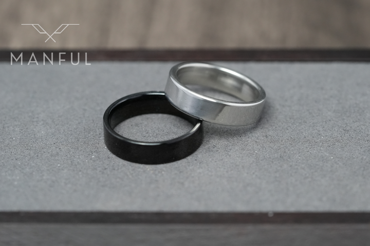 Simple 6mm Ring Black, standing beside a silver ring for a colour comparison