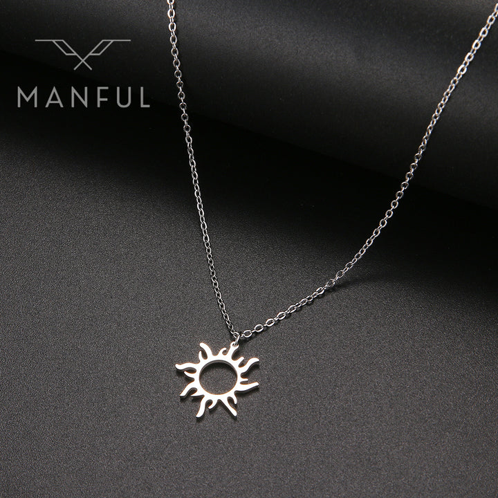 Sun Pendant Necklace Silver, hanging against a dark textured background
