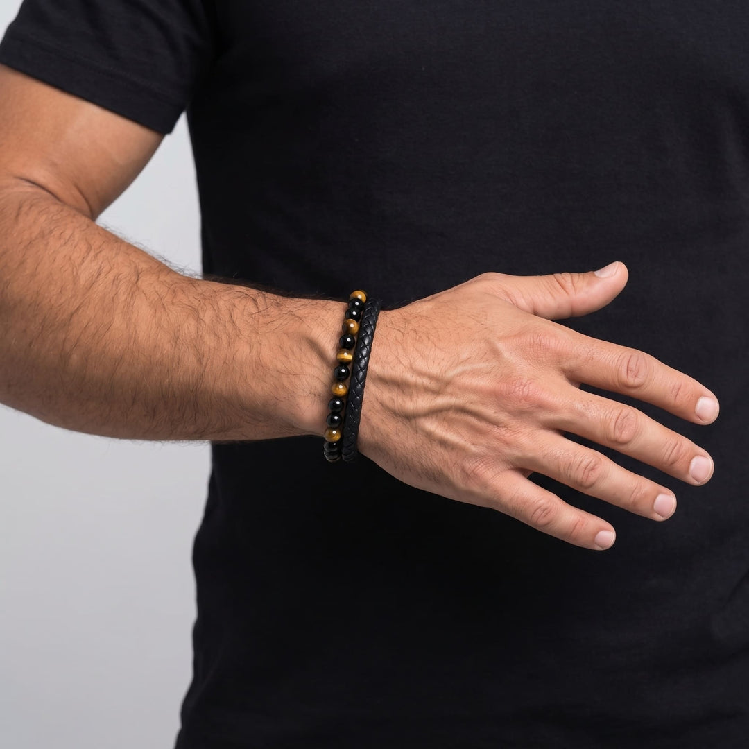 Tigers Eye Bead And Leather Bracelet on a man's wrist, his hand held across his body