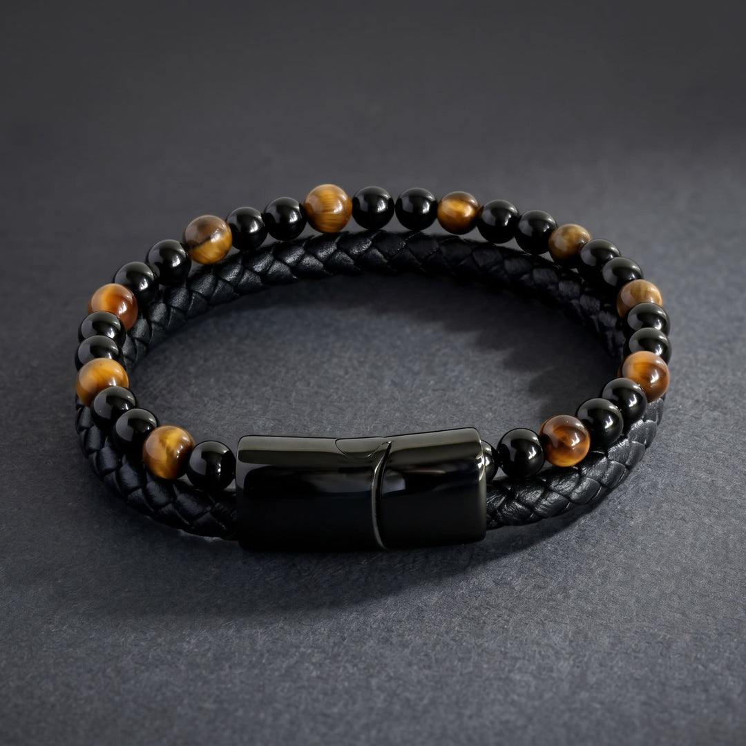 Tigers Eye Bead And Leather Bracelet lying on matte charcoal