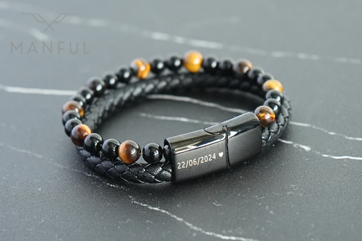 Tigers Eye Bead And Leather Bracelet, close-up of the clasp engraved with a date and heart