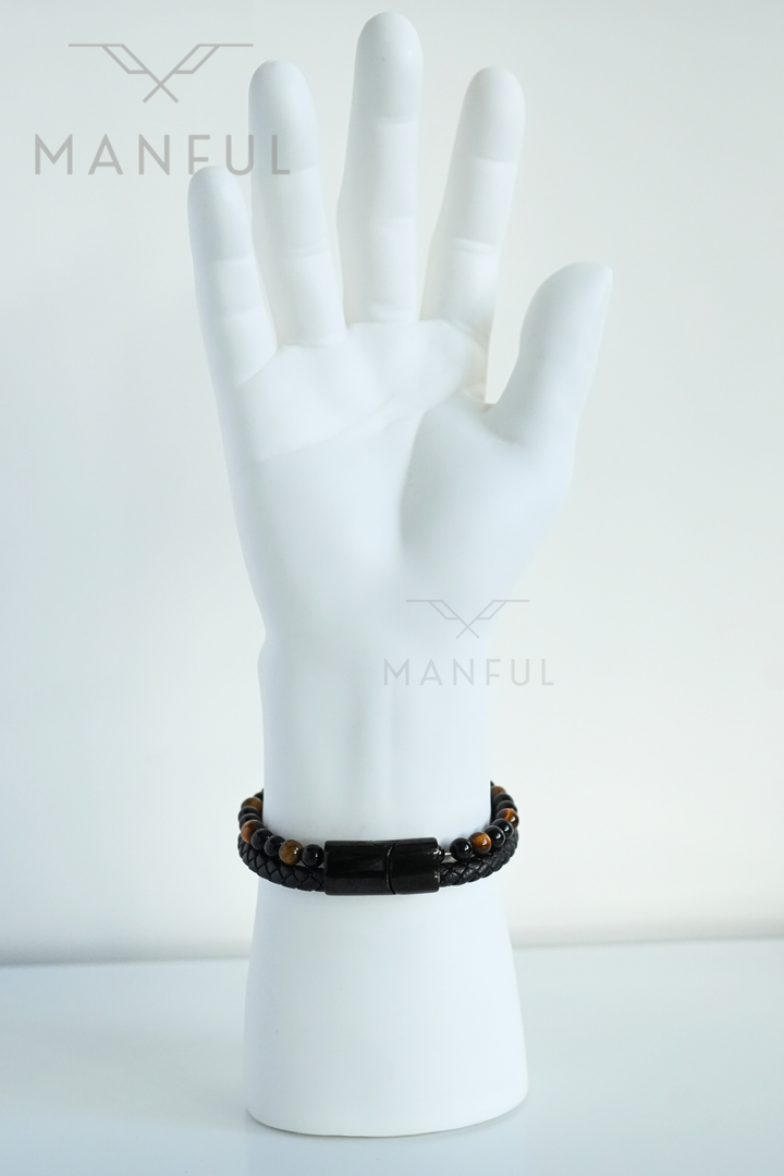 Tigers Eye Bead And Leather Bracelet, worn on a mannequin wrist with fingers held together